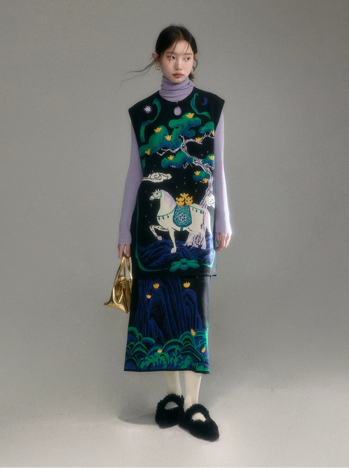 Woman wearing a patterned dress with a horse design on a plain background