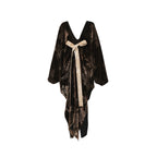 Black velvet dress with a beige ribbon on a white background