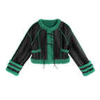 Black and green jacket with fuzzy texture on a white background