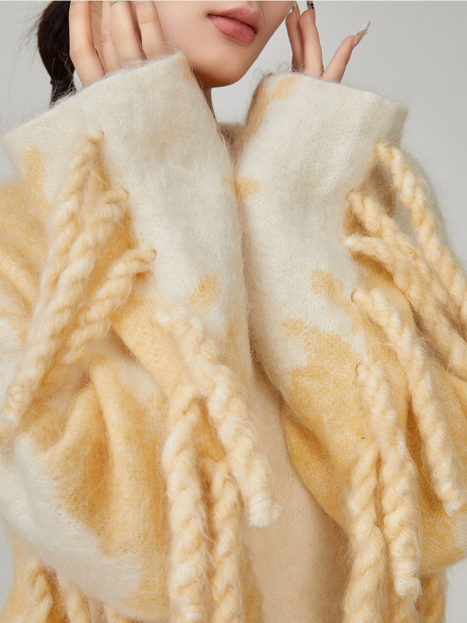 Close-up of a textured beige fabric with braided design