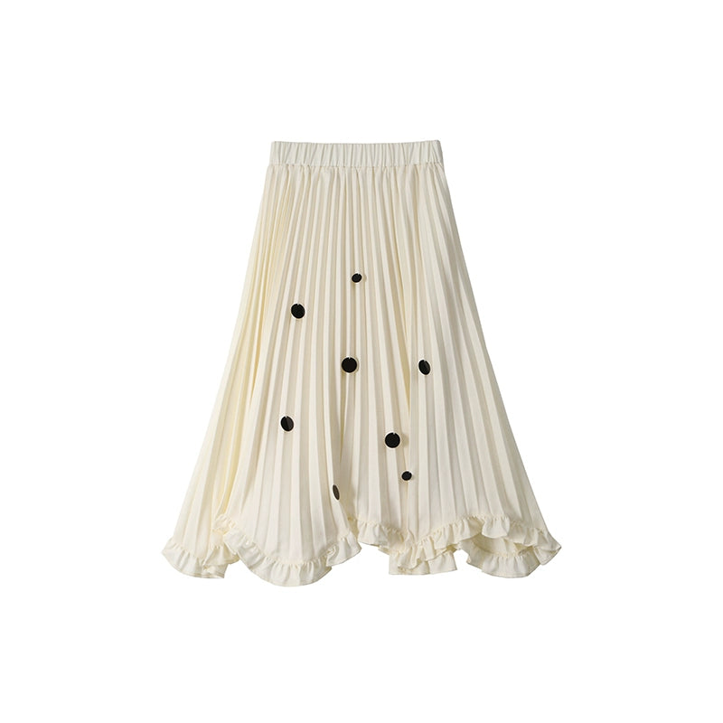 White pleated skirt with black button details on a white background