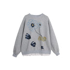 Gray sweatshirt with floral embroidery on a white background