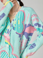Colorful knitted cardigan with abstract patterns on a neutral background