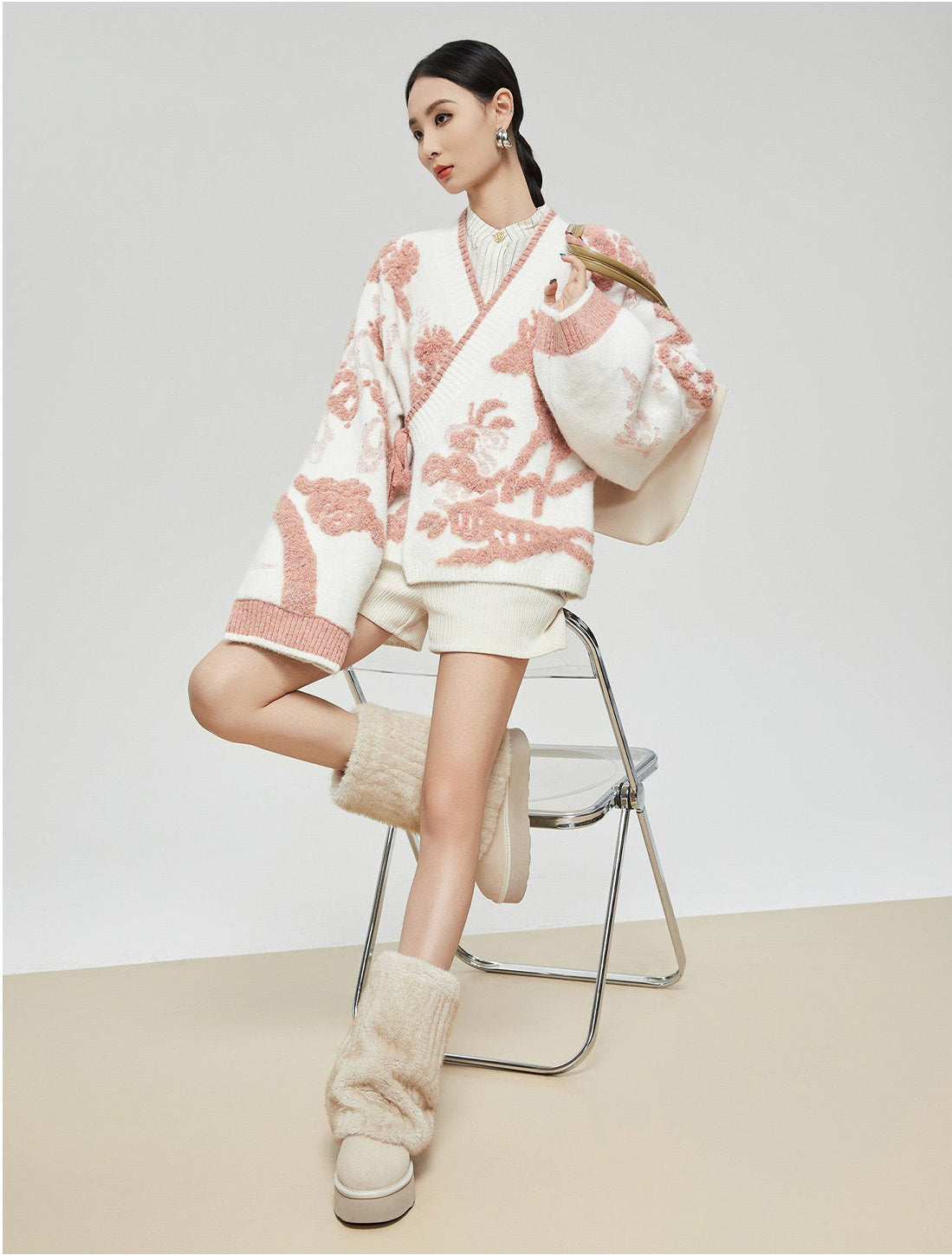 Woman wearing a floral kimono-style outfit with a white background, featuring the brand 'FAIRY ETTE'.