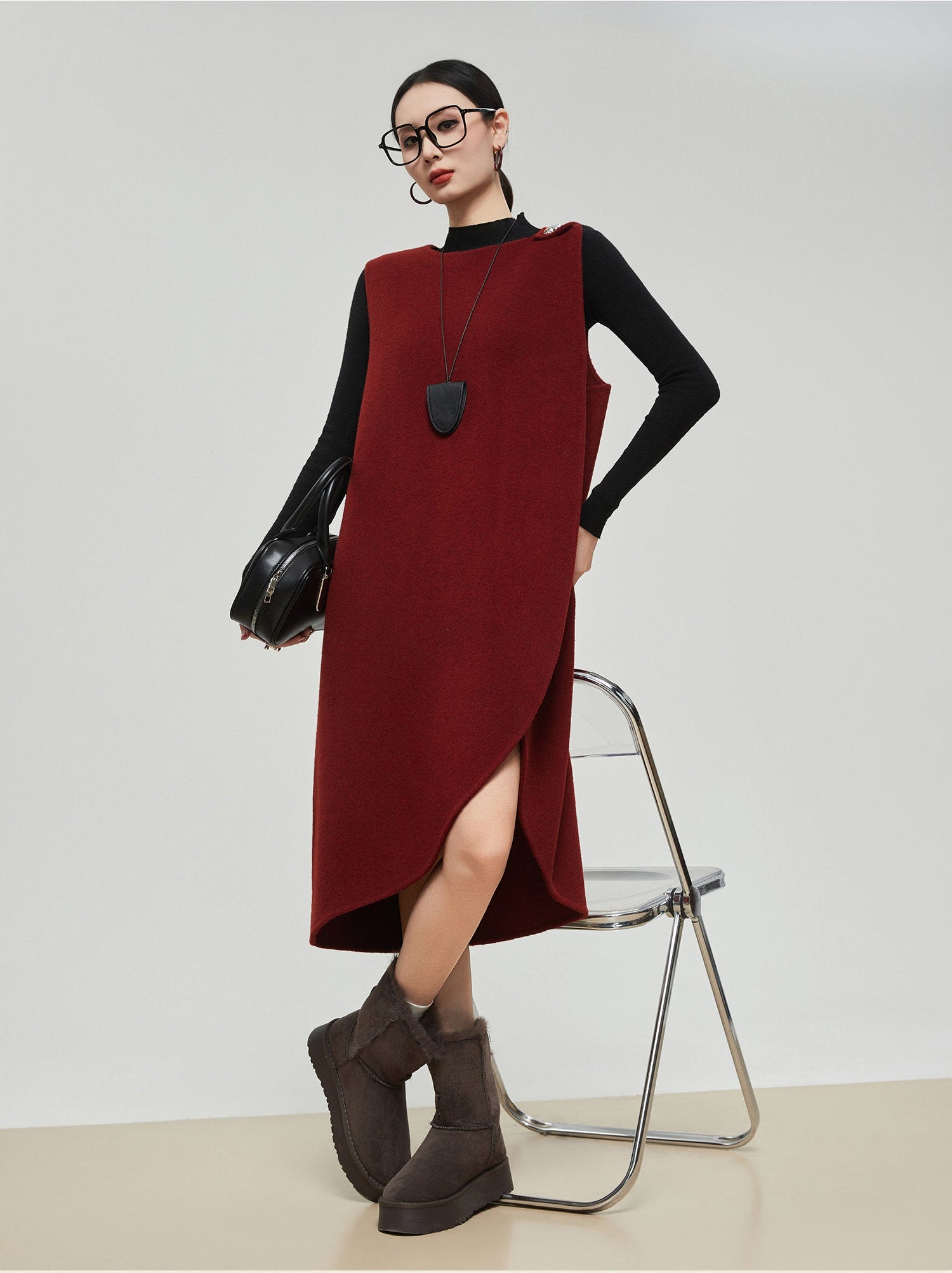 Woman wearing a red dress and black shoes on a white background