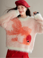 Person wearing a fluffy pink sweater with orange abstract design and red beret.