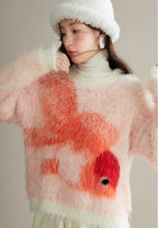 Person wearing a fluffy sweater with abstract red and pink patterns on a neutral background