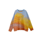 Sweater with gradient color from blue to yellow to orange on a white background