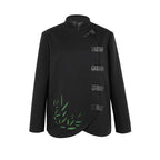 Black coat with green leaf design on a white background